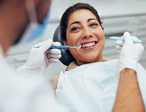 Woman in dentist’s chair undergoing treatment