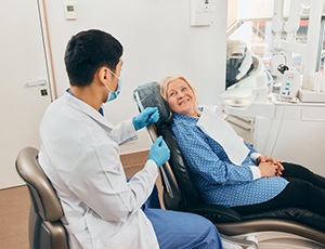 Dentist and patient talking about treatment options