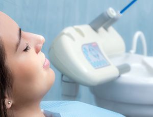 Close-up of relaxed female dental patient with closed eyes