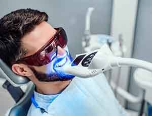 a man getting in-office teeth whitening