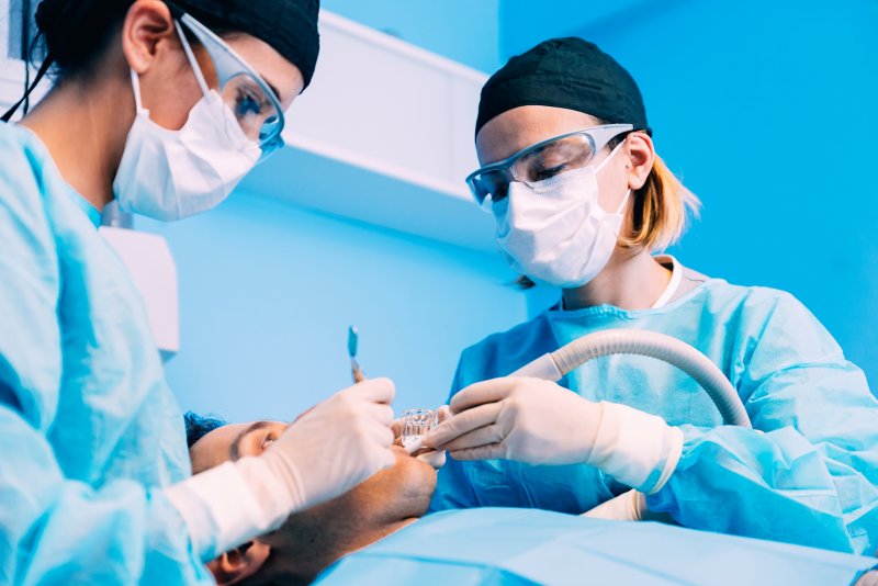 Dentists performing surgery